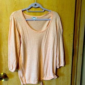 Peach colored, 3/4 sleeves.